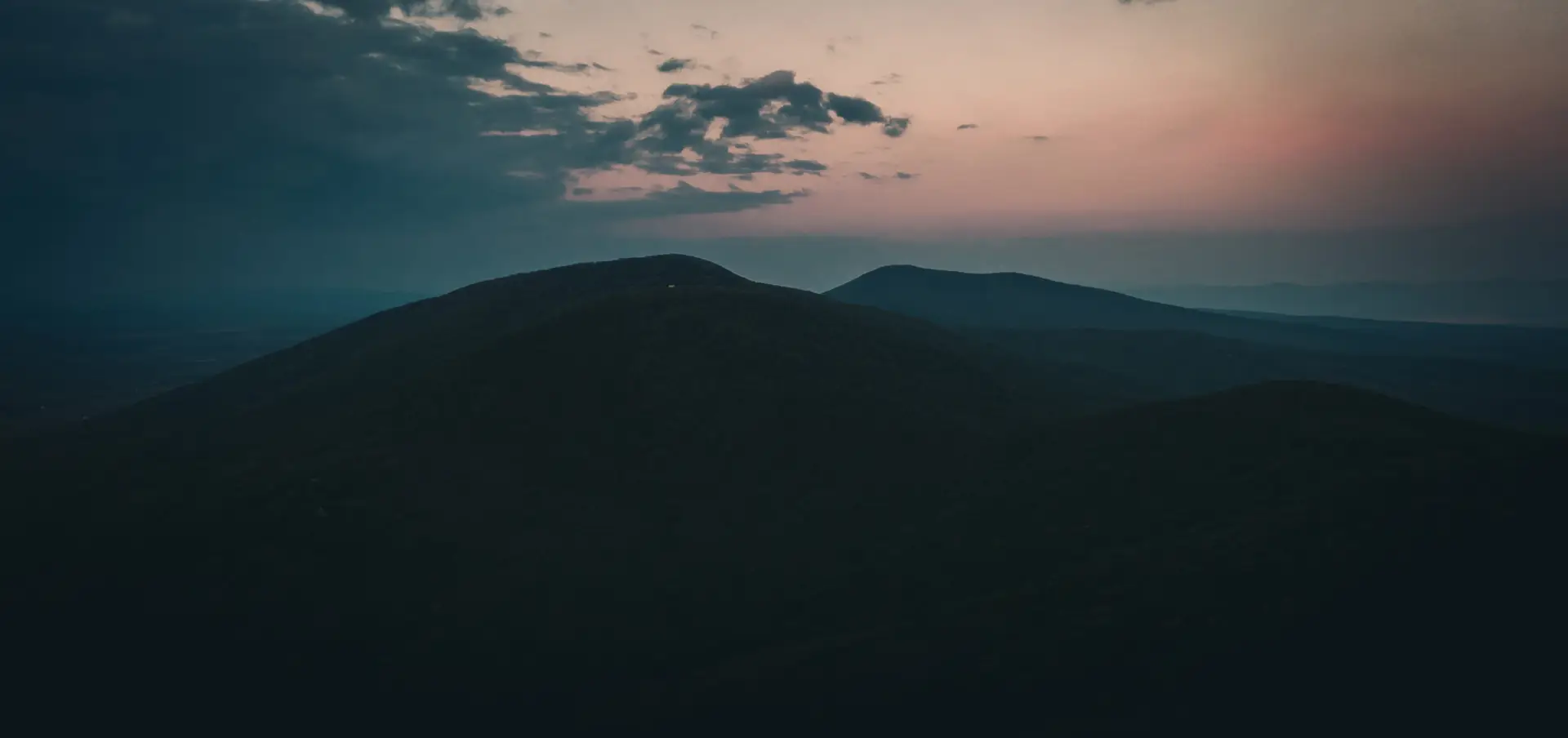 sunrise-landscape-of-mountain-from-air-on-misty-day